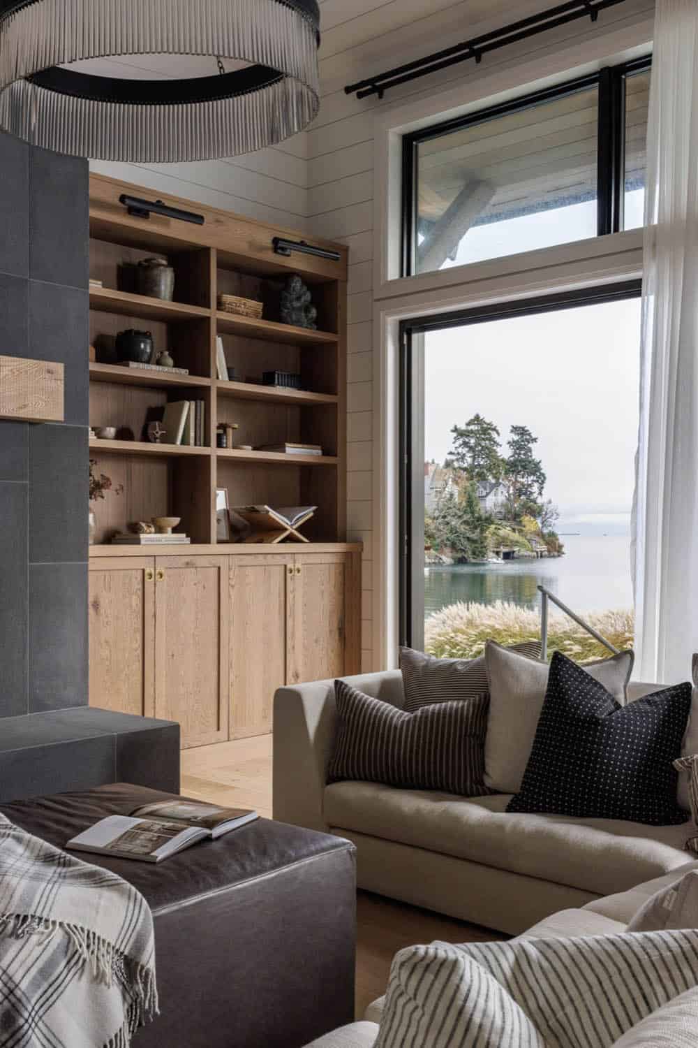 beach style living room with built-in display shelves