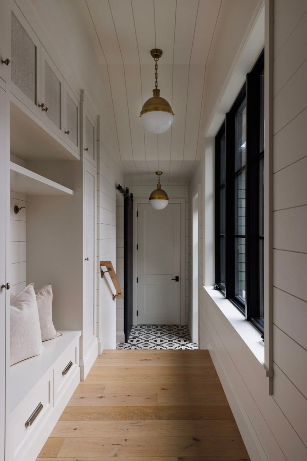 beach style hallway with a built-in bench