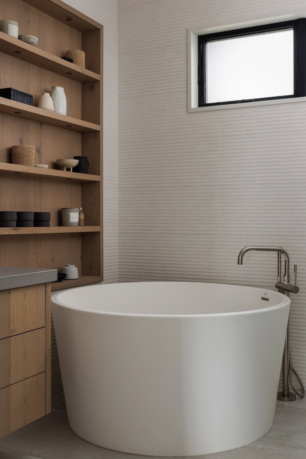 beach style bathroom with a freestanding tub