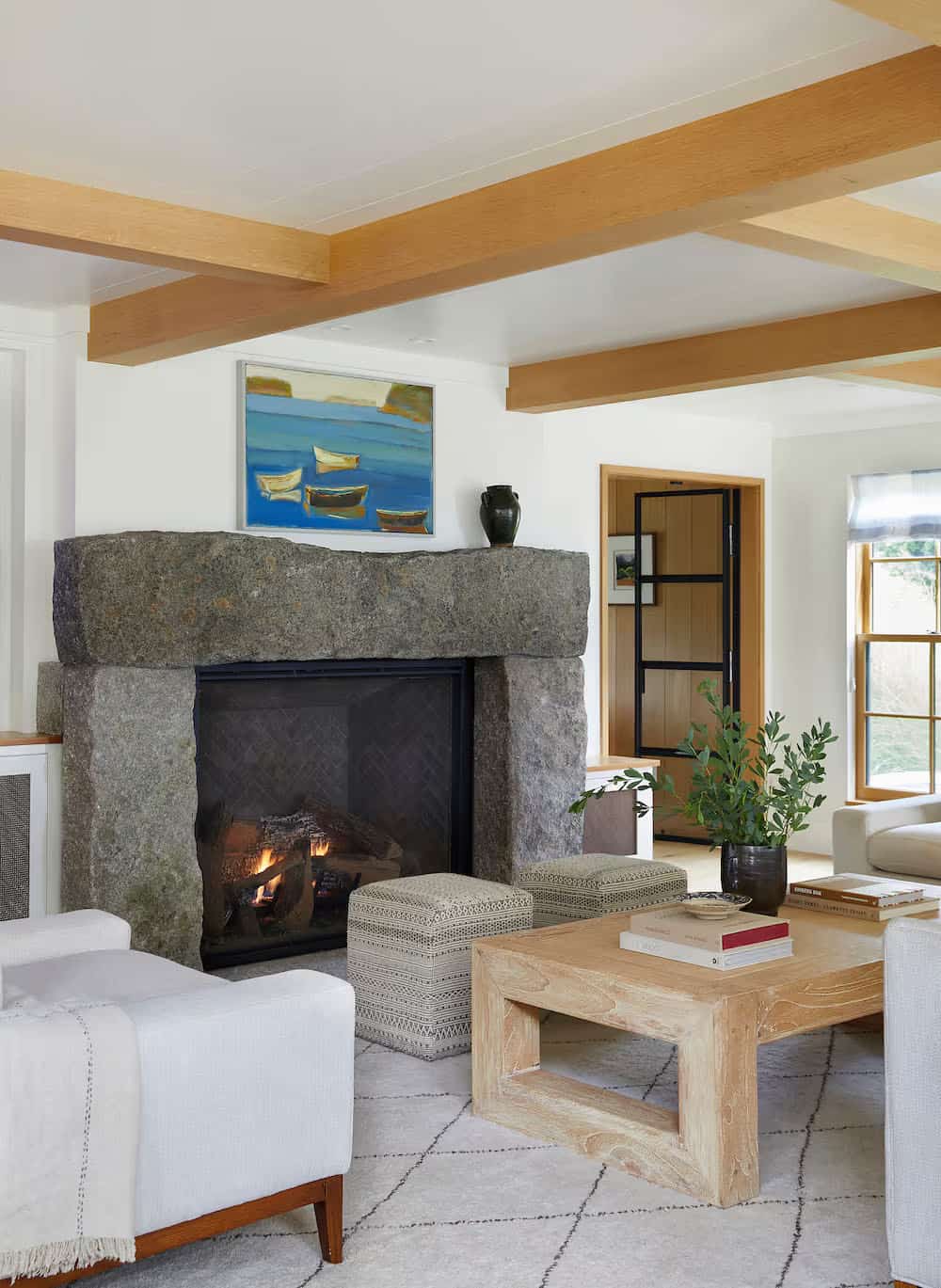 modern coastal style living room with a fireplace
