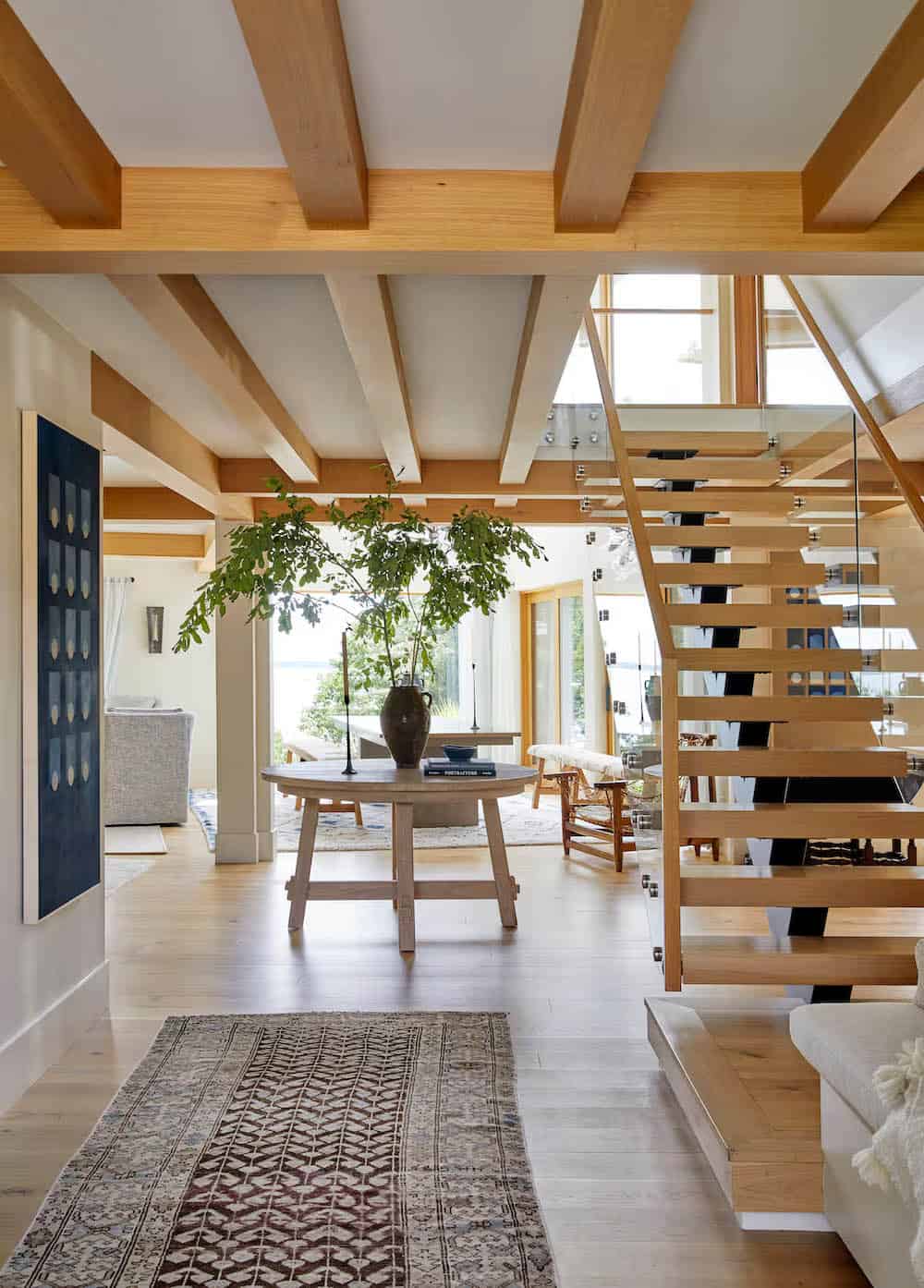 modern coastal home entry with a staircase