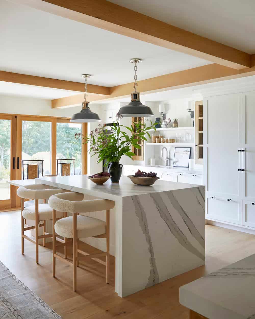 modern coastal style kitchen with a waterfall island
