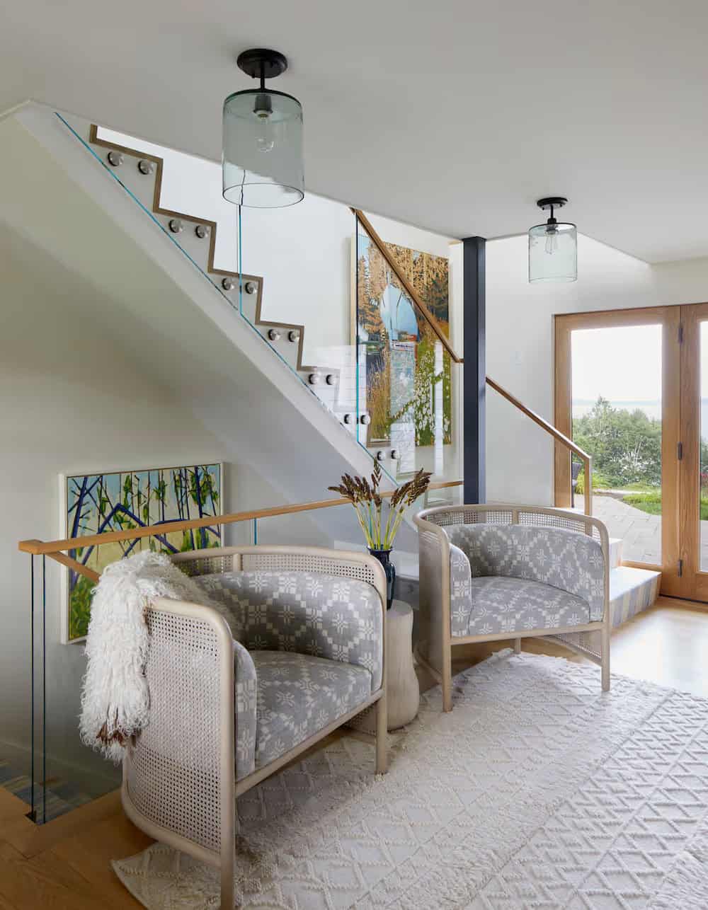 modern coastal style hallway with a pair of chairs