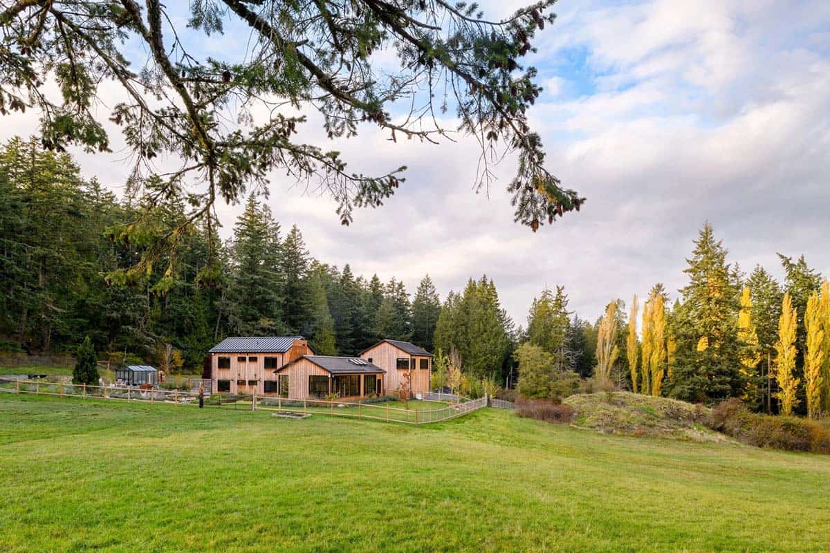 Modern farmhouse exterior with scenic island views and lush greenery