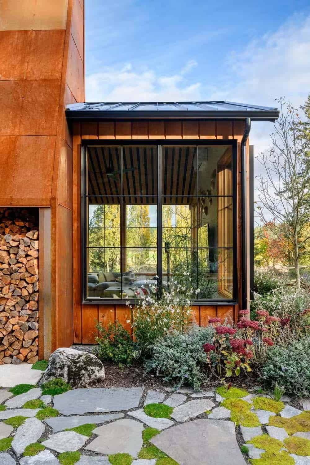 Modern Farmhouse Family Home on Orcas Island with large glass windows.