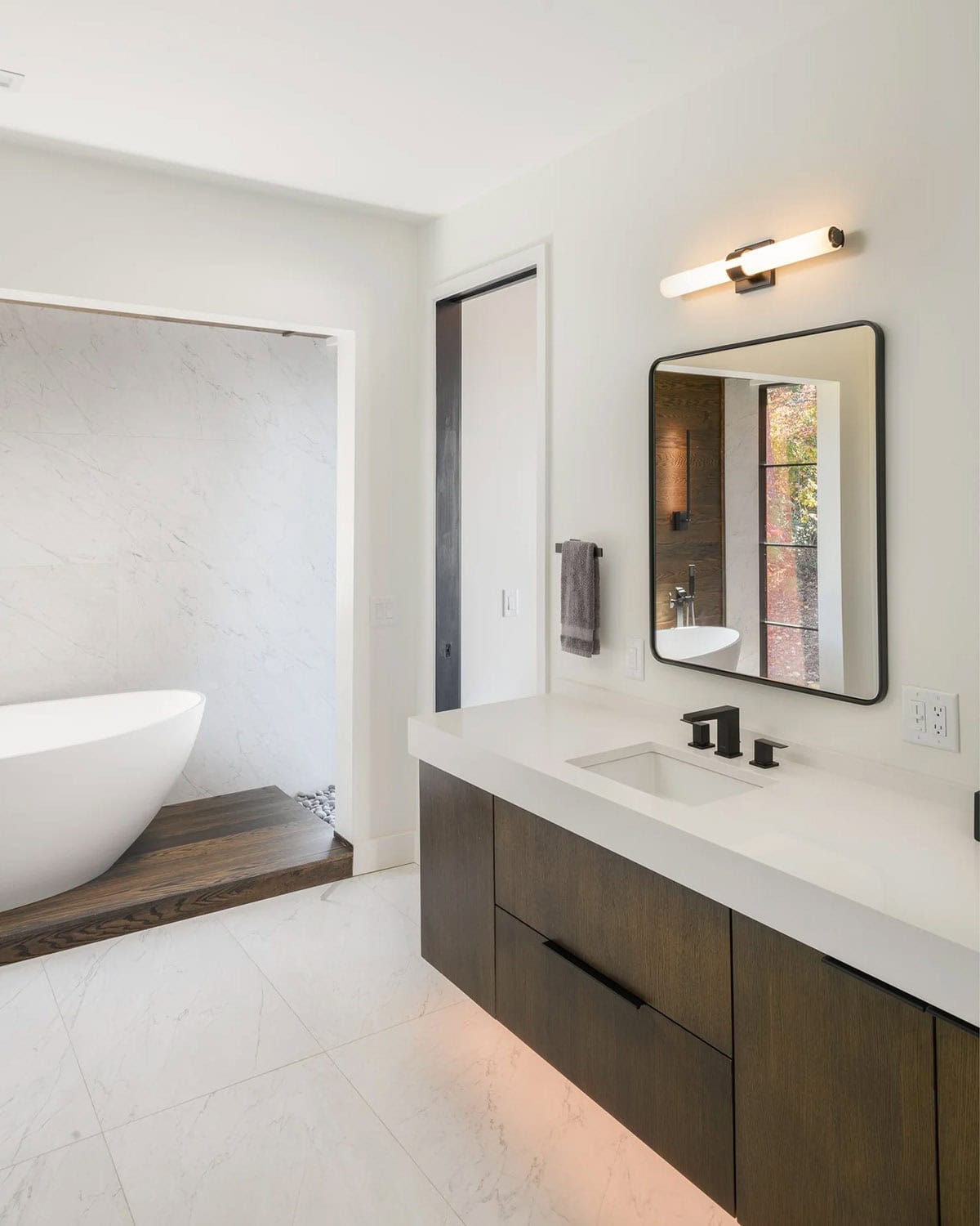 modern bathroom with a vanity and freestanding tub