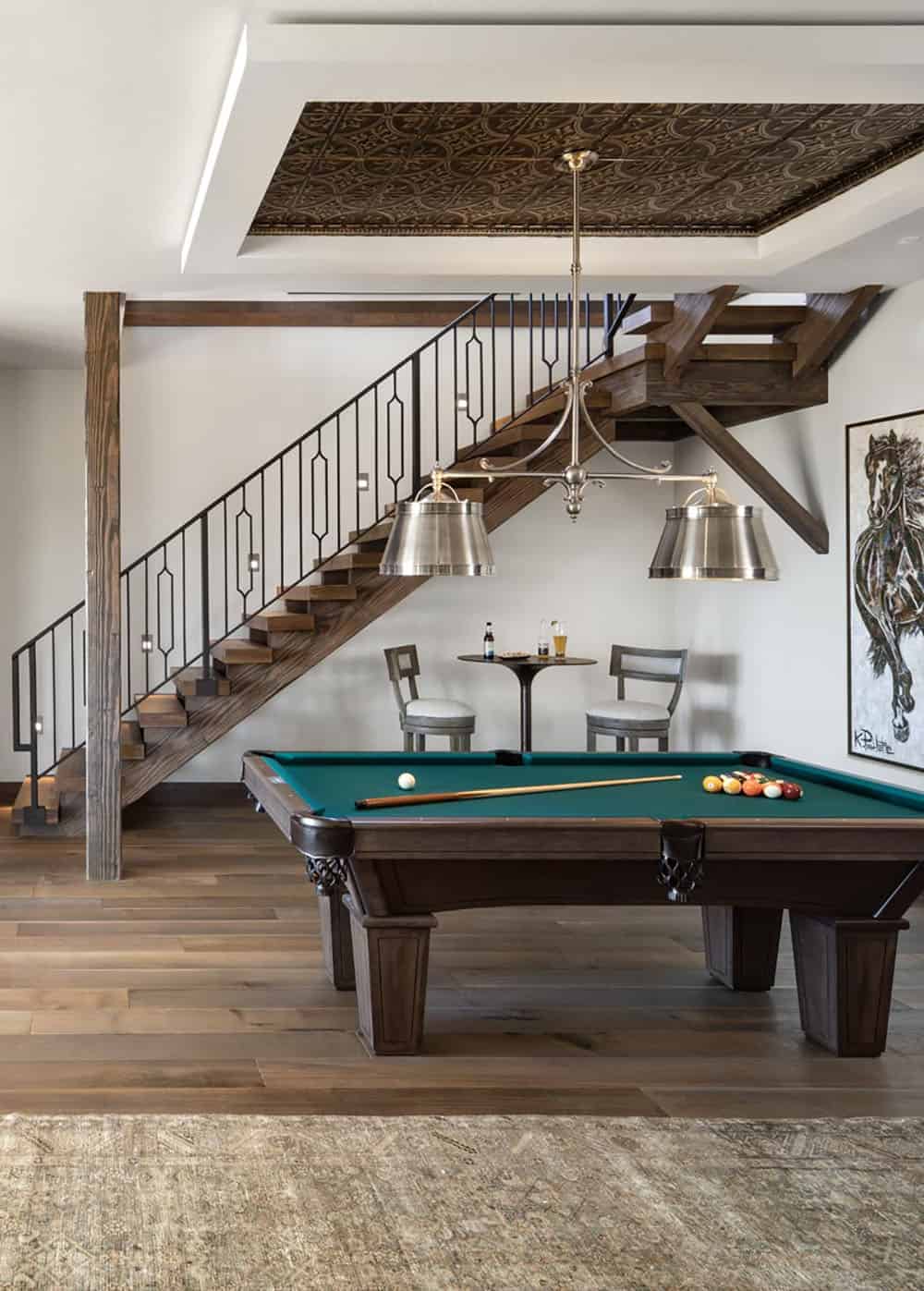 modern rustic lower-level game room with a pool table