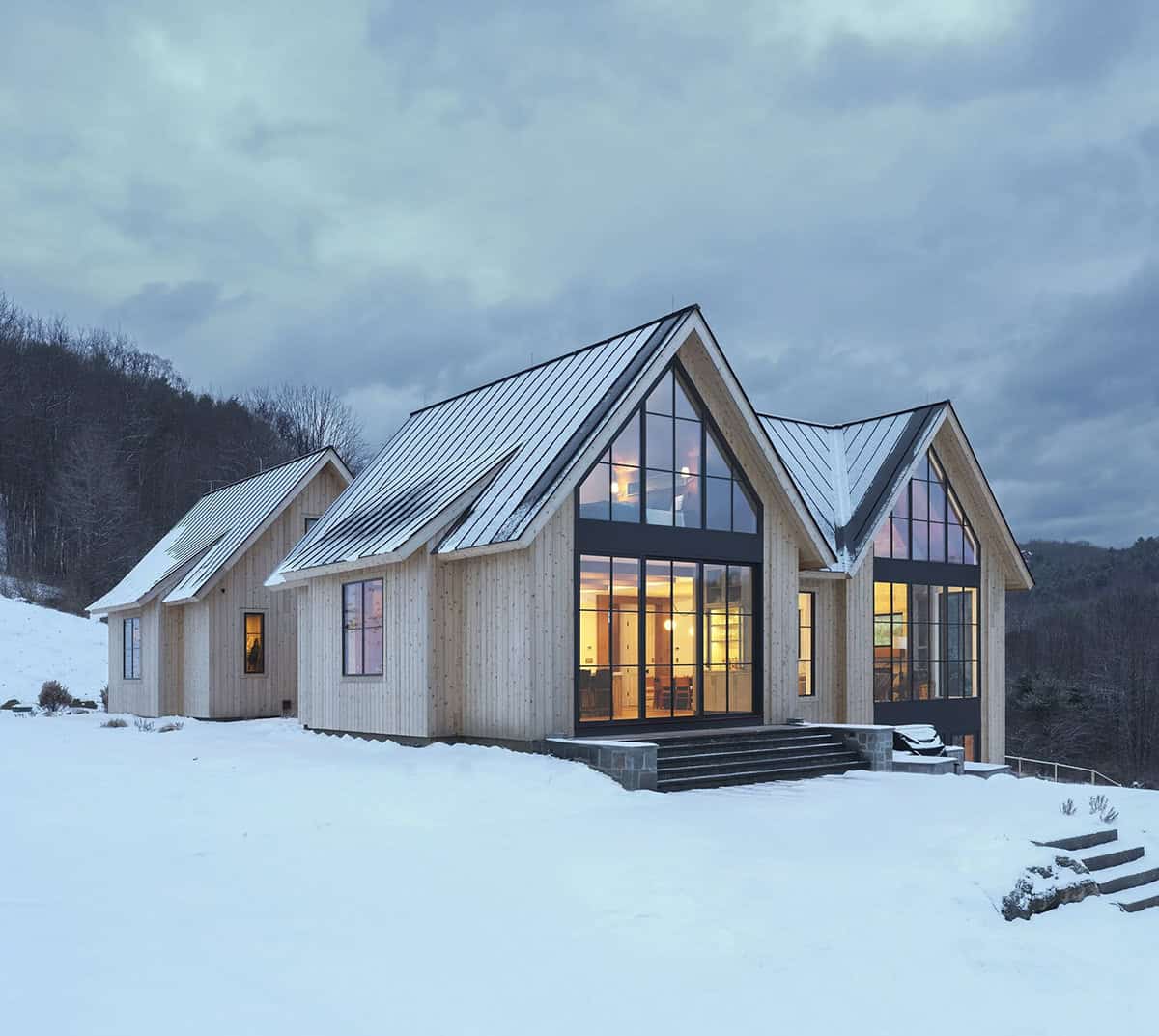 modern scandinavian home exterior with snow