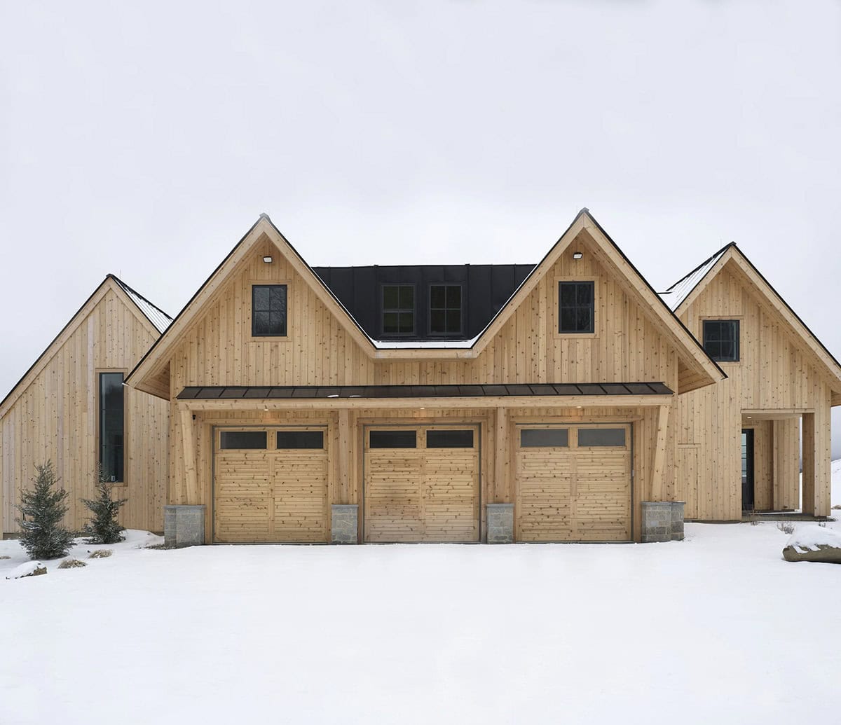 modern scandinavian home exterior with snow