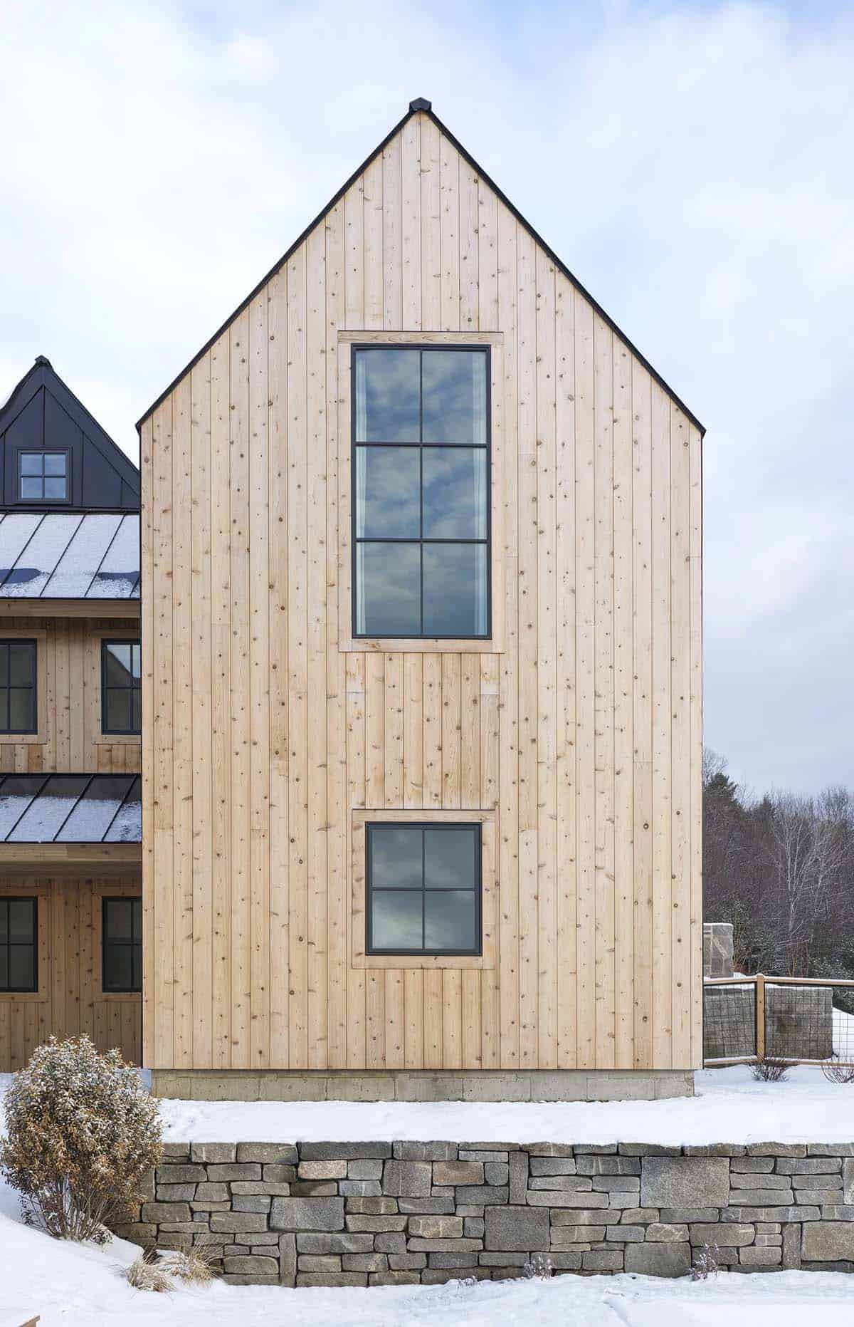 modern scandinavian home exterior with snow