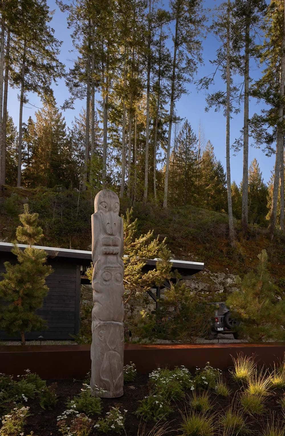 modern coastal home with a totem pole