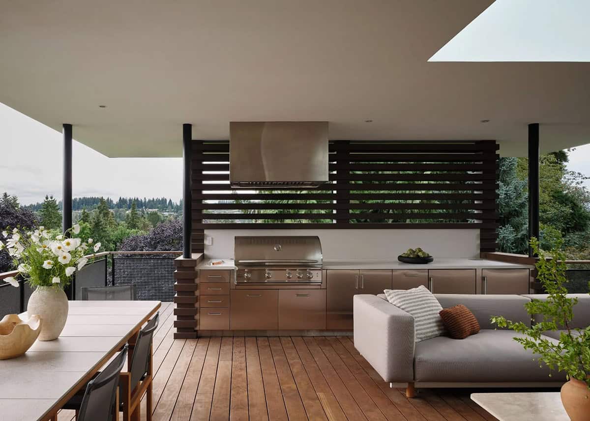 contemporary covered patio with outdoor furniture and a grill