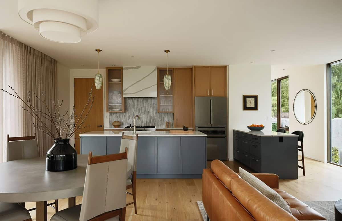 contemporary kitchen open to the living and dining room