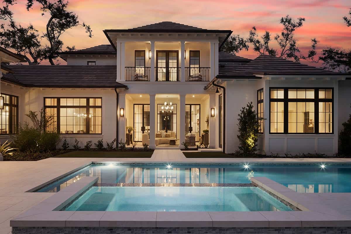 waterfront home exterior with a pool