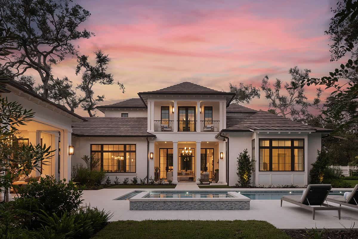 waterfront home exterior with a pool