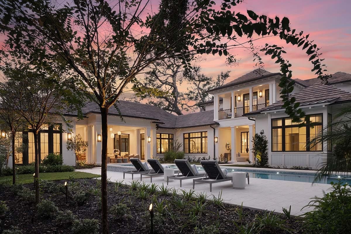 waterfront home exterior with a pool