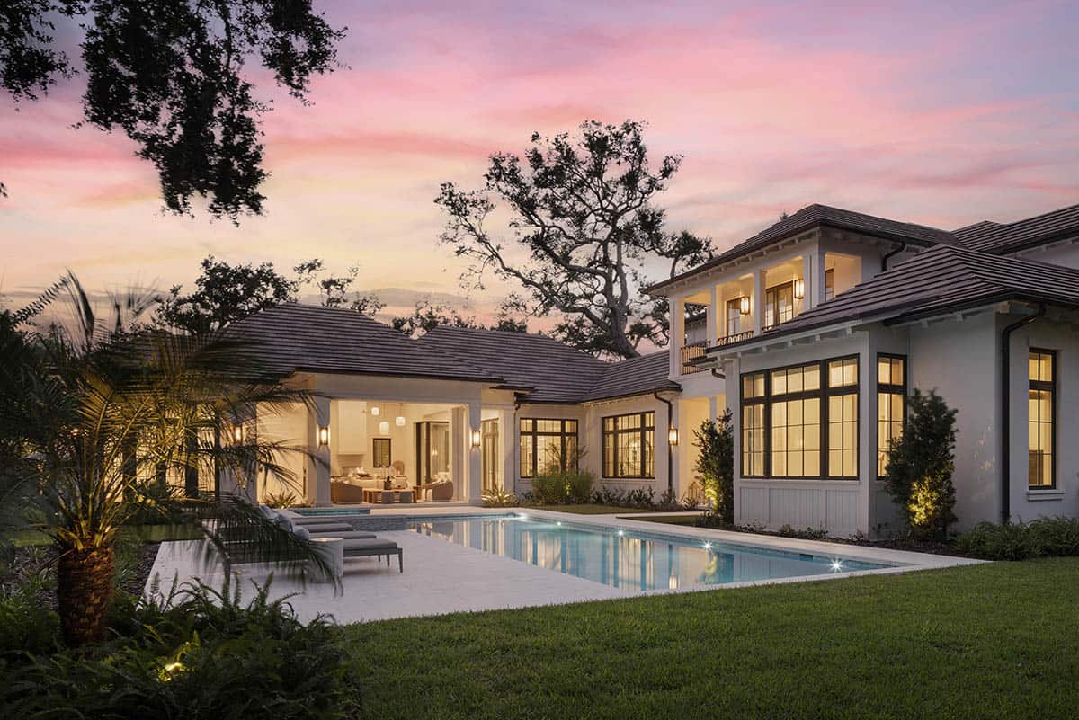 waterfront home exterior with a pool