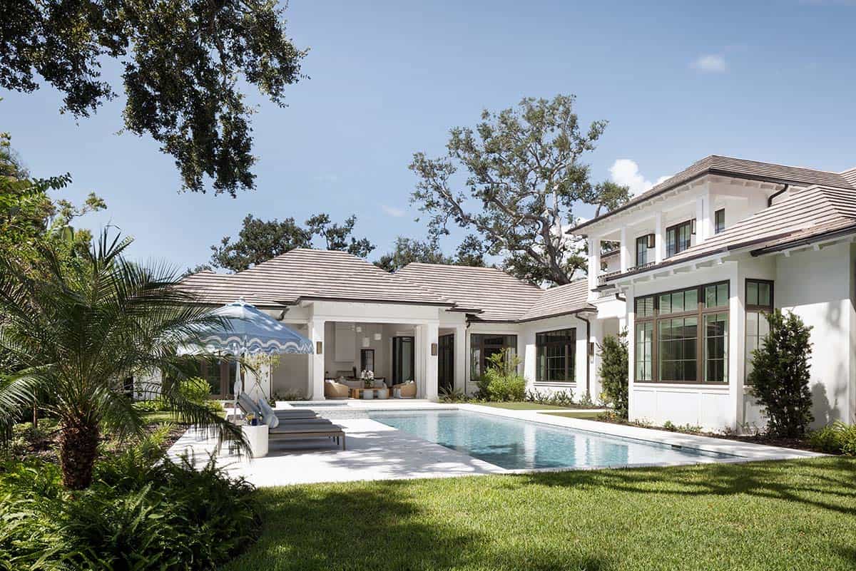 waterfront home exterior with a pool