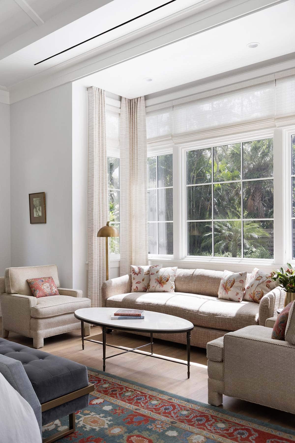 coastal style bedroom with a sitting area