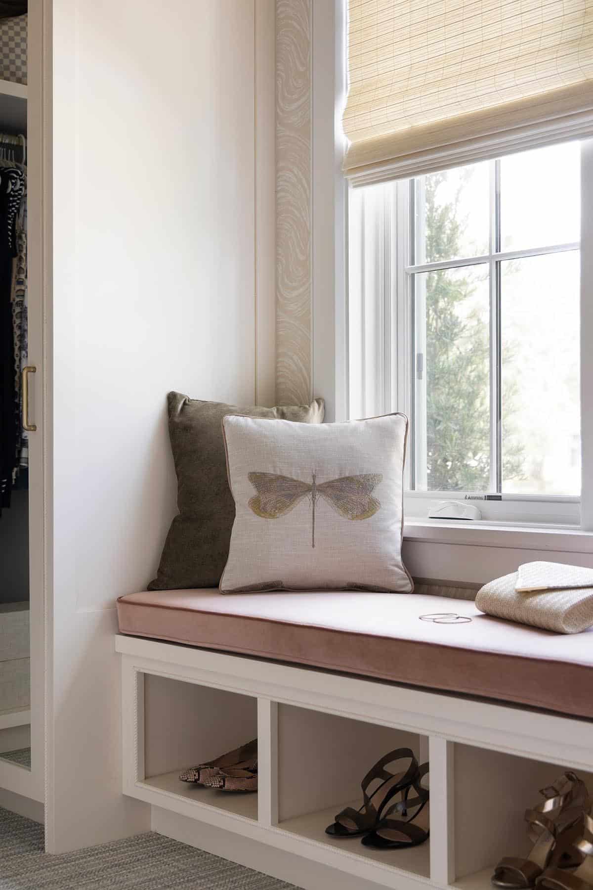 coastal style closet with a built-in window seat