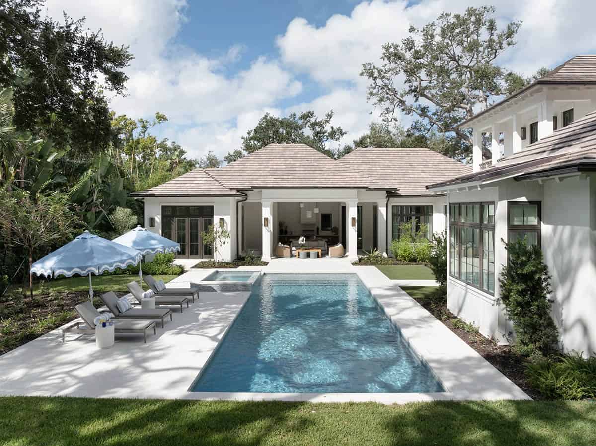 coastal style home with a pool