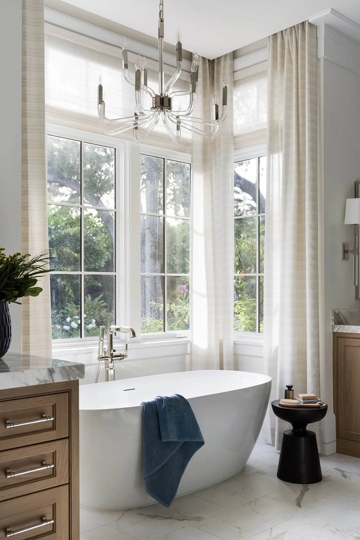 coastal style bathroom with a freestanding tub
