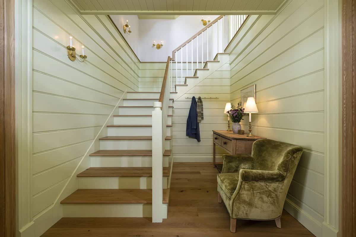 rustic colonial home entry with a staircase