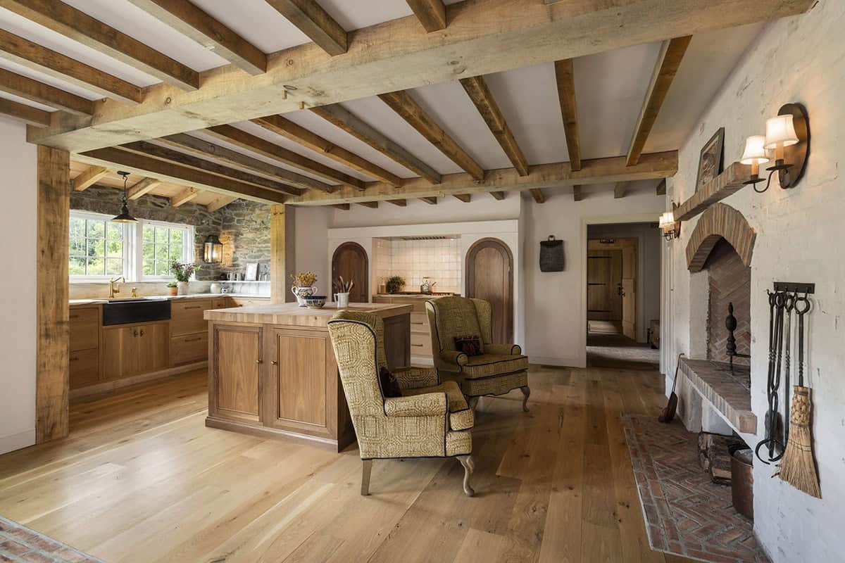 rustic kitchen with a sitting area and fireplace
