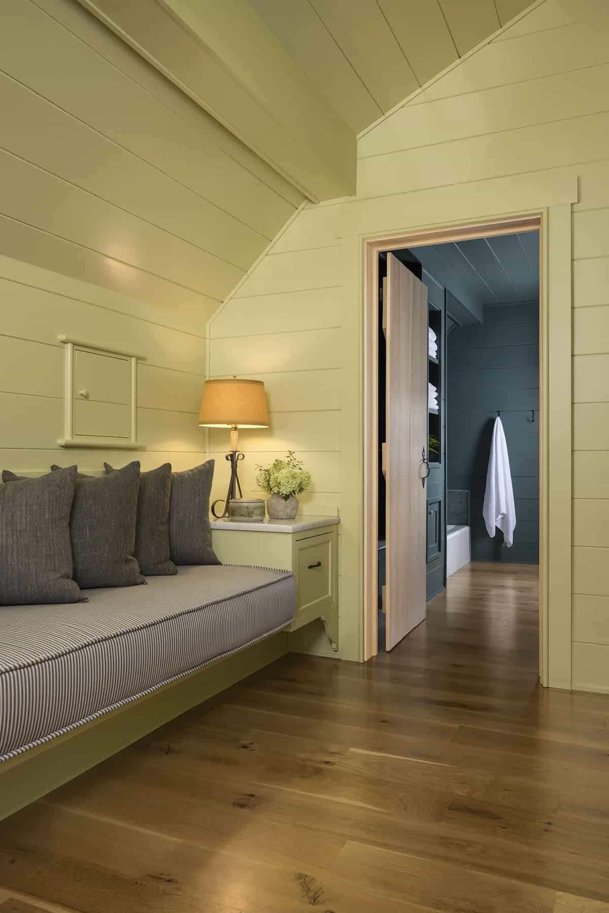 rustic built-in seating bench with a door to the bathroom