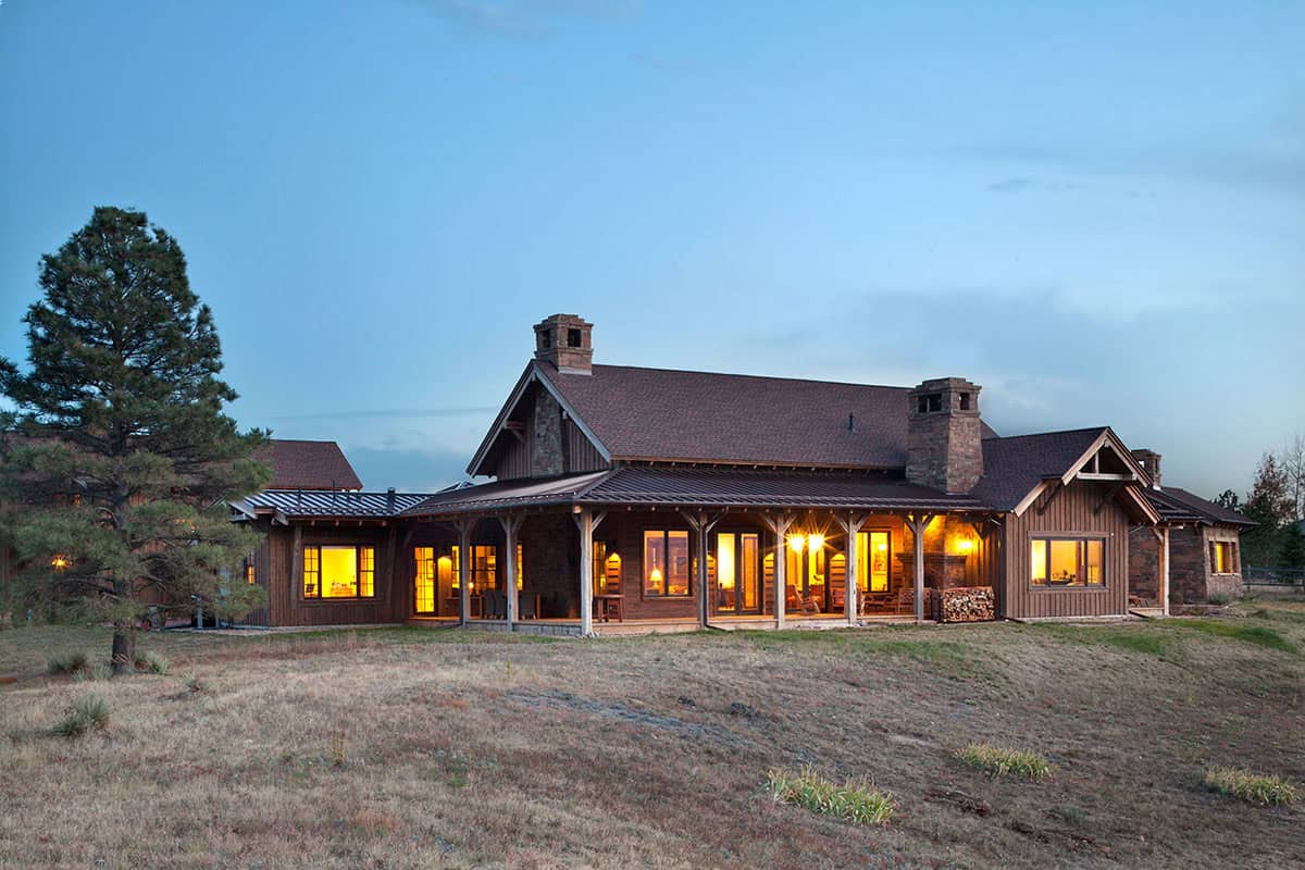 rustic ranch style home exterior at dusk