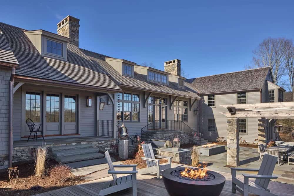 Saltbox Farm house patio with outdoor furniture and a fire pit