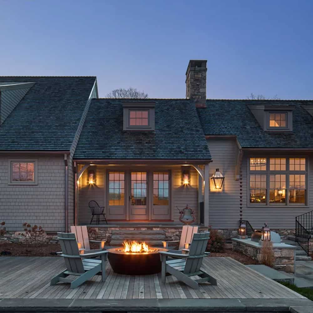 Saltbox Farm house exterior backyard view at dusk