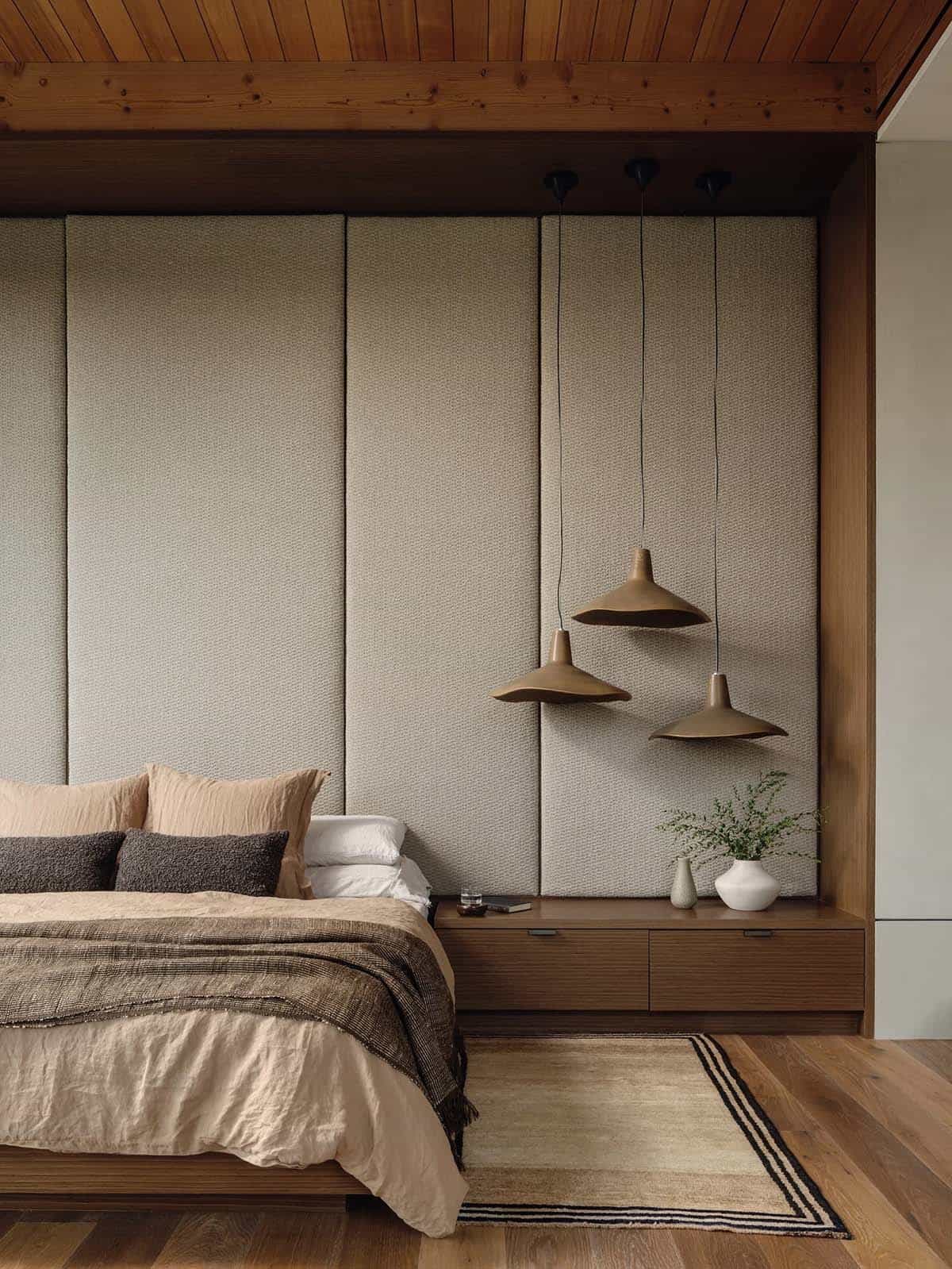 modern bedroom with an upholstered headboar