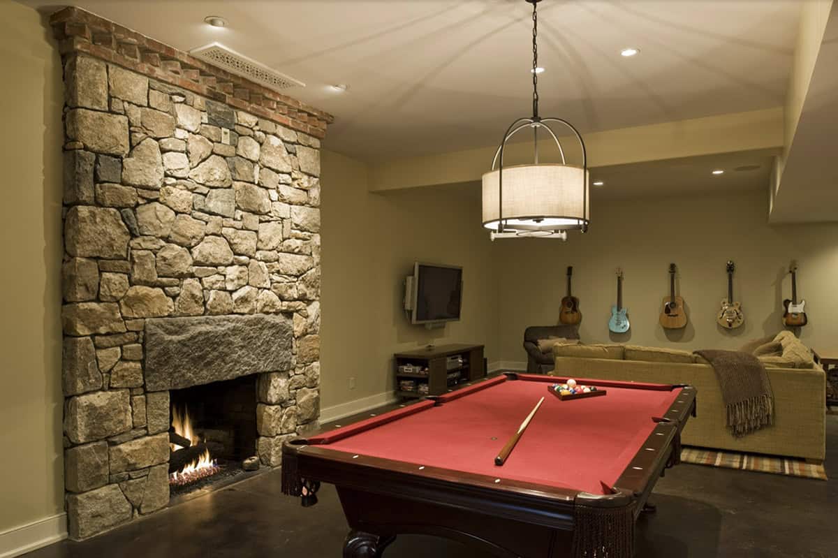 Traditional Family Room with a fireplace and pool table