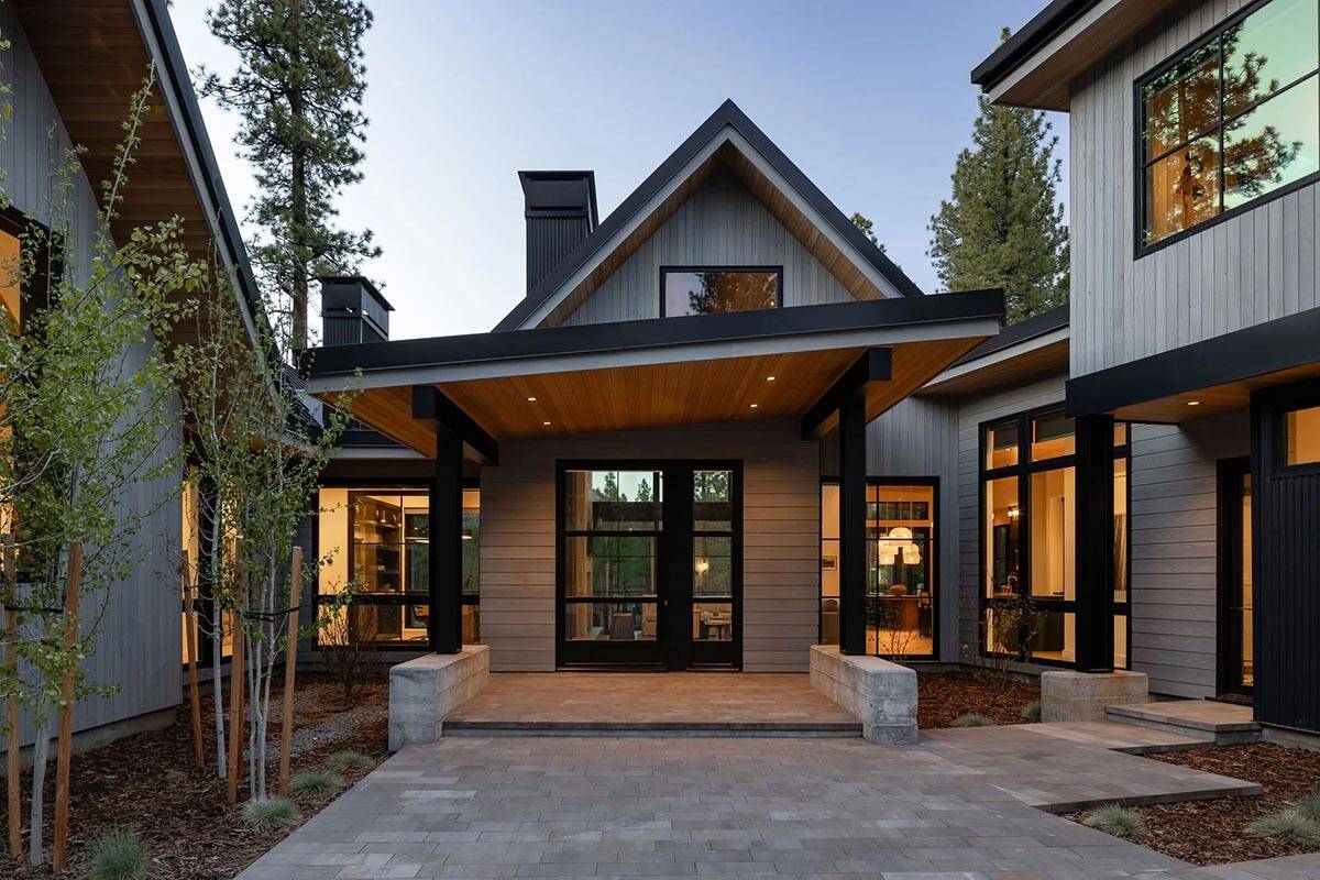 transitional mountain home exterior at dusk