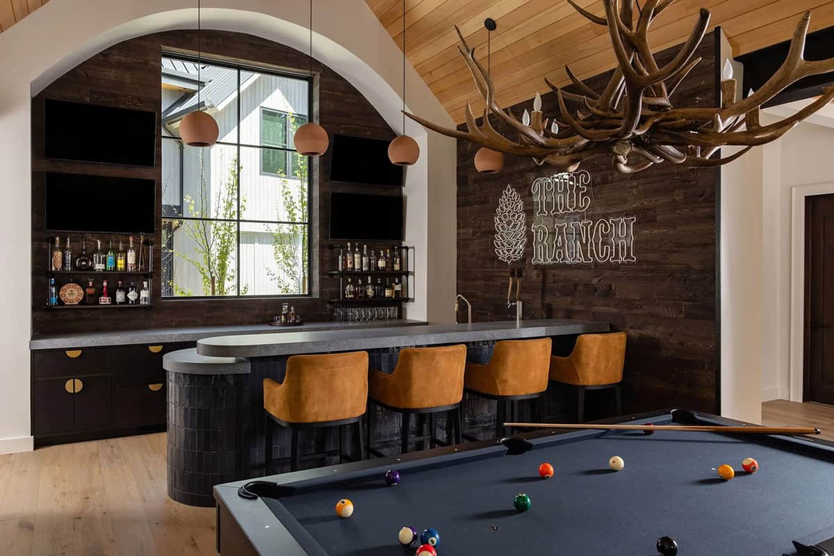 transitional home bar with a pool table