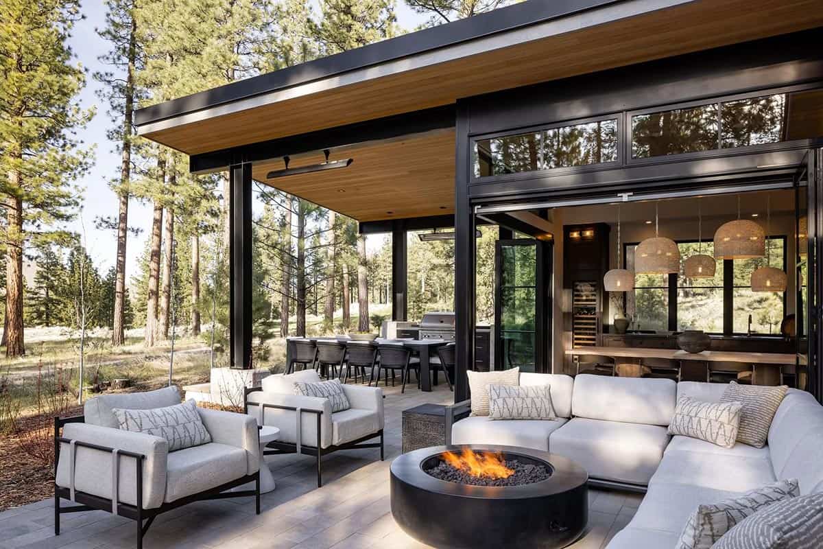 transitional mountain home exterior deck with outdoor furniture and a fire pit