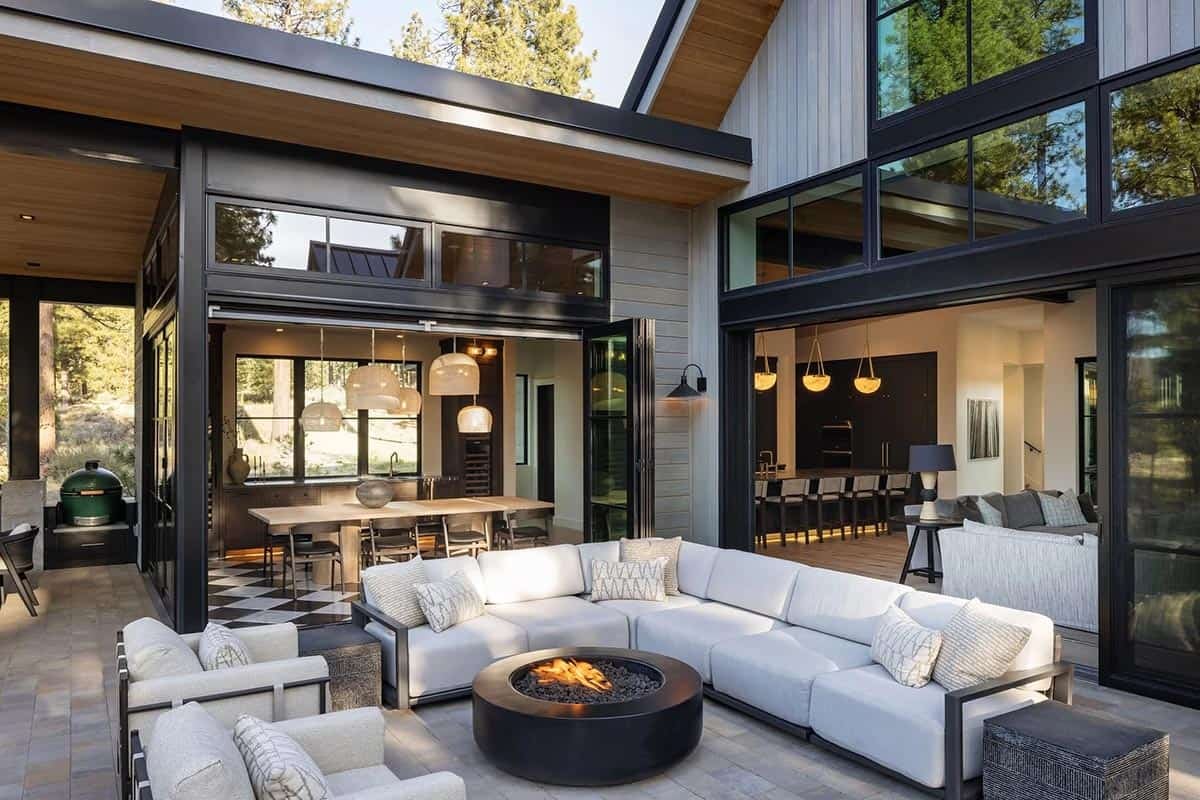 transitional mountain home exterior deck with outdoor furniture and a fire pit