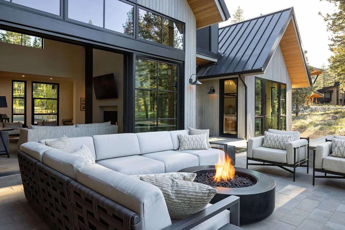 transitional mountain home exterior deck with outdoor furniture and a fire pit
