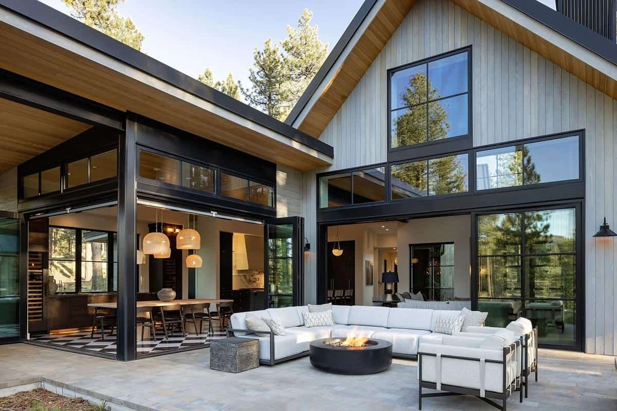 transitional mountain home exterior deck with outdoor furniture and a fire pit