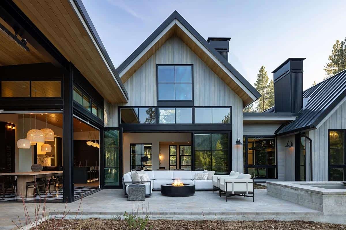 transitional mountain home exterior deck with outdoor furniture and a fire pit