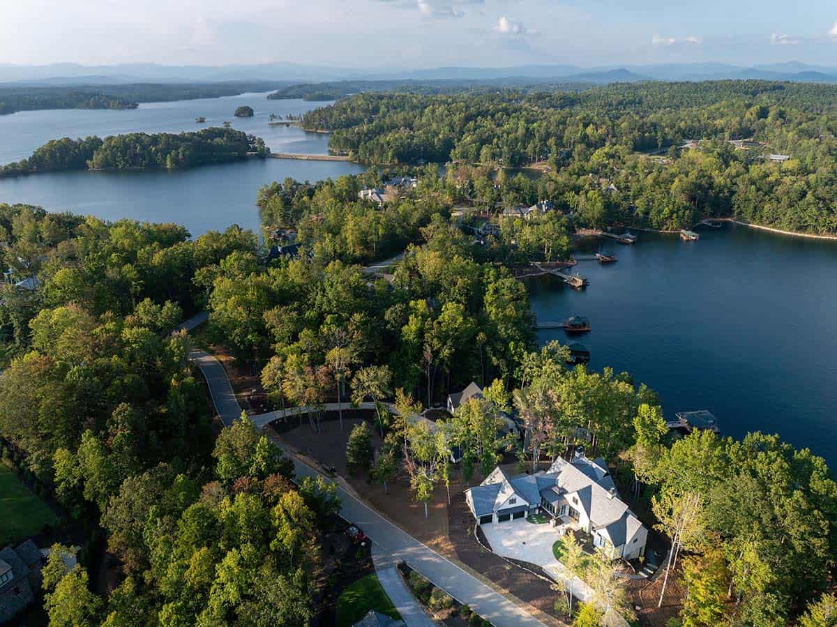 transitional style lake house exterior aerial view