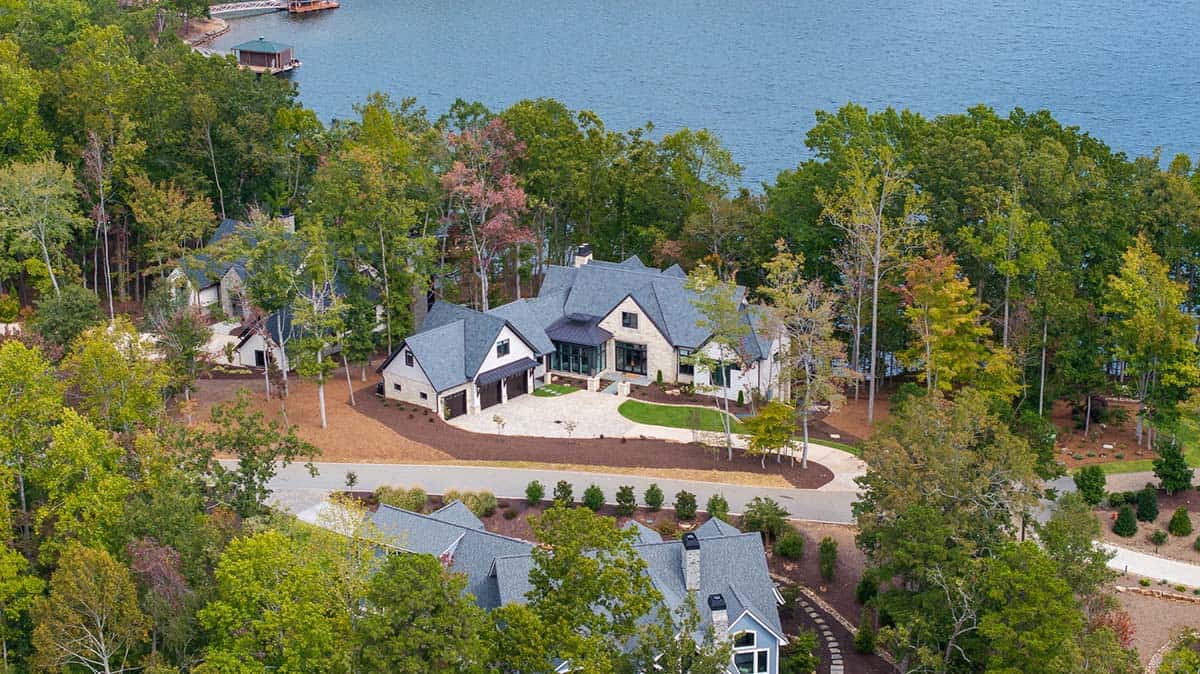 transitional style lake house exterior aerial view