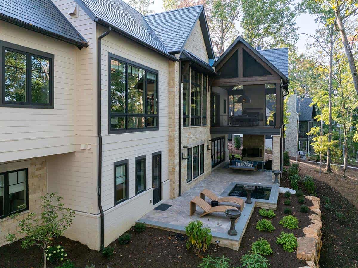 transitional style lake house exterior backyard view