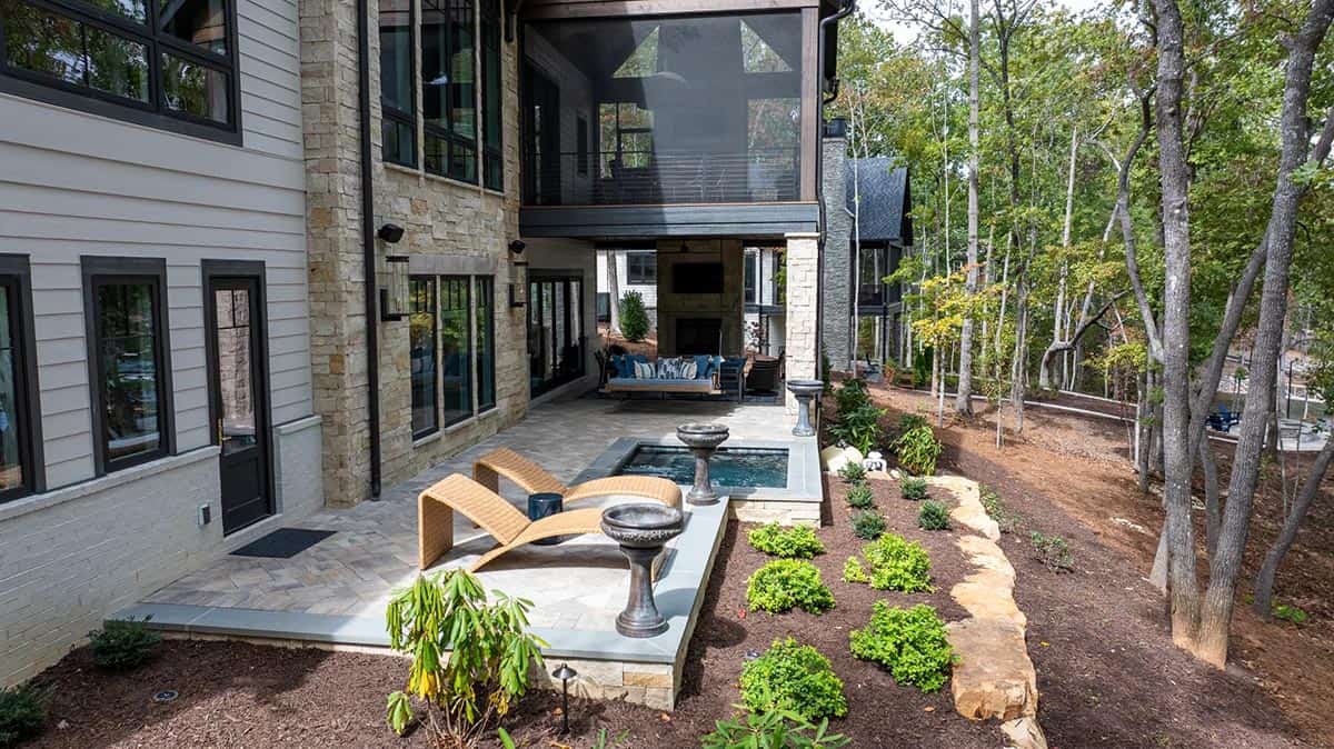 transitional style lake house exterior backyard view