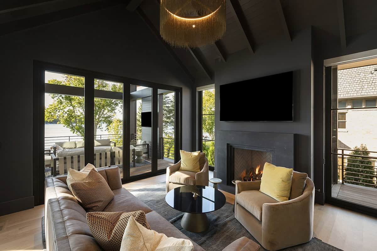 transitional style moody sunroom with a staircase