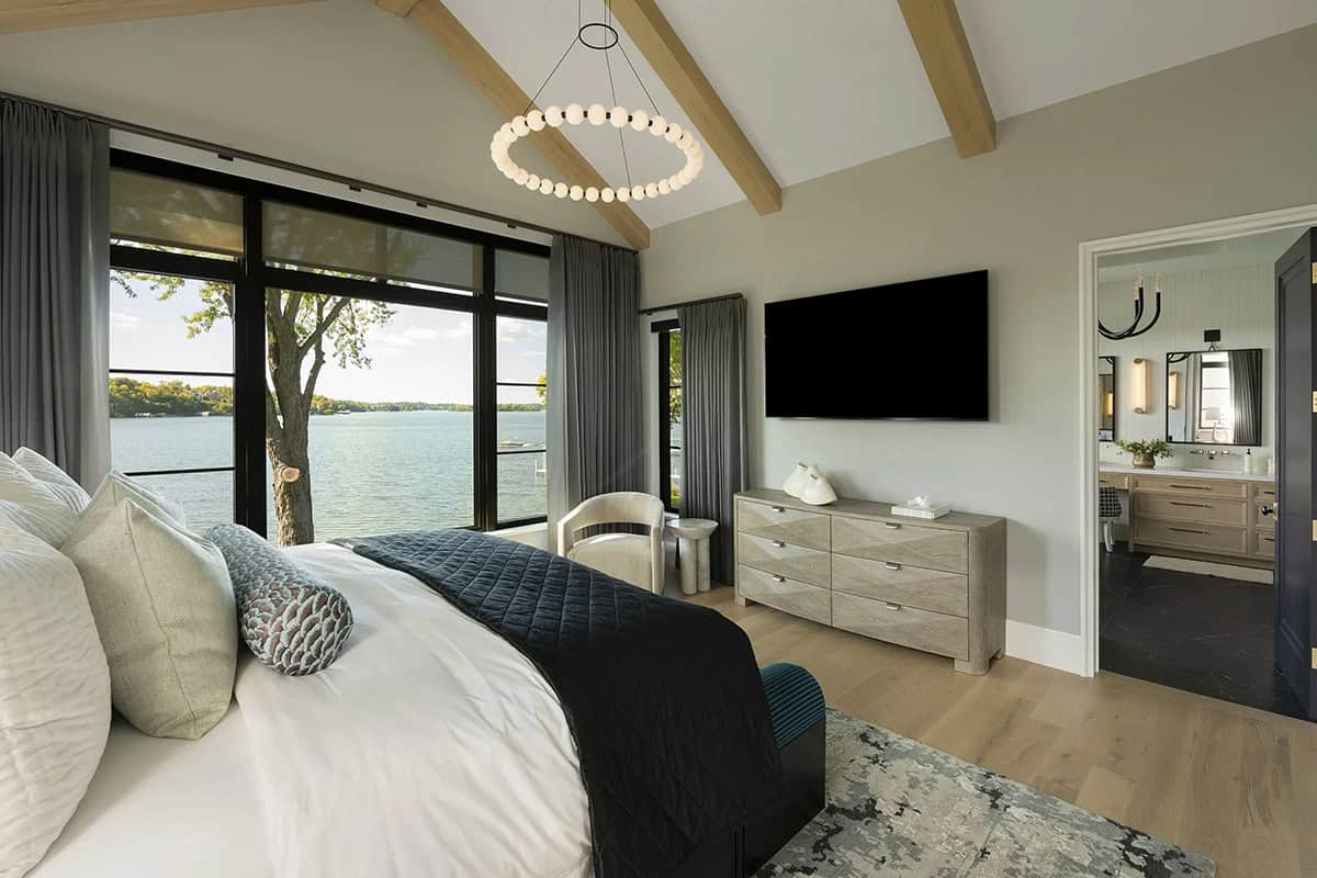 transitional style bedroom with a large window