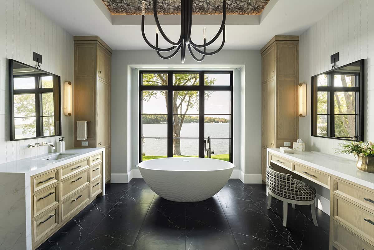 transitional style bathroom with a freestanding tub
