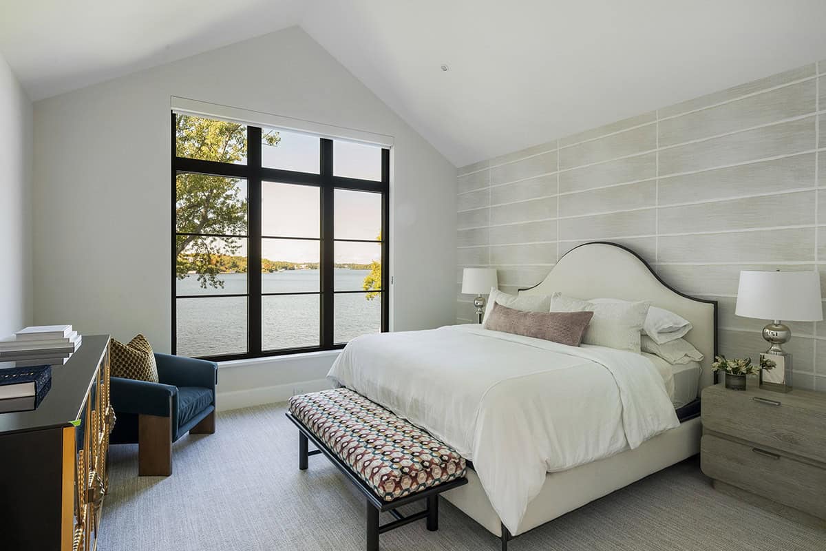 transitional style bedroom with a large window