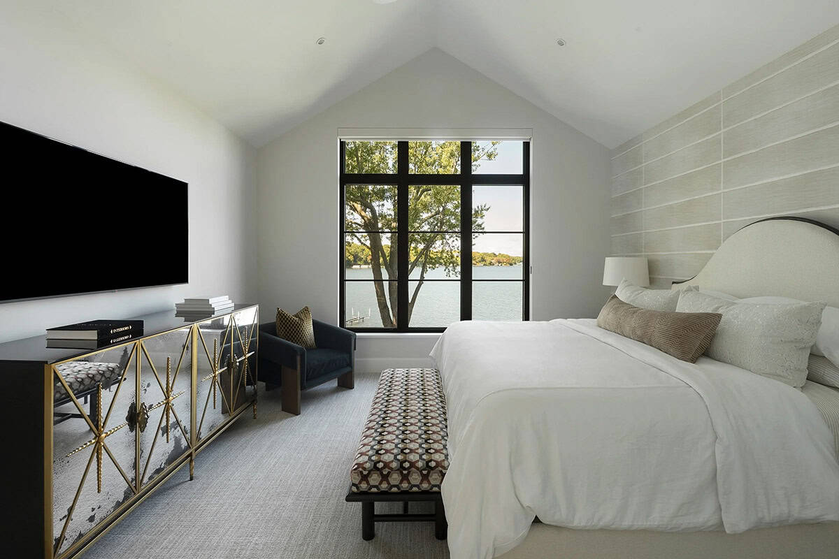transitional style bedroom with a large window